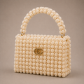 Ceylan Ivory Pearl Clasp bag, angled view